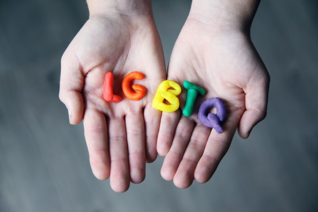 lgbtq letters in hand pexels